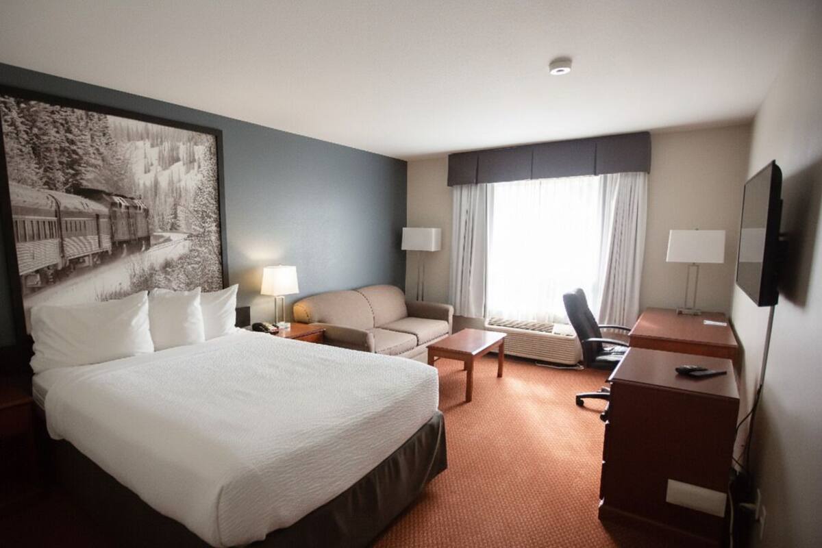Premium bedding, down comforters, laptop workspace, blackout drapes