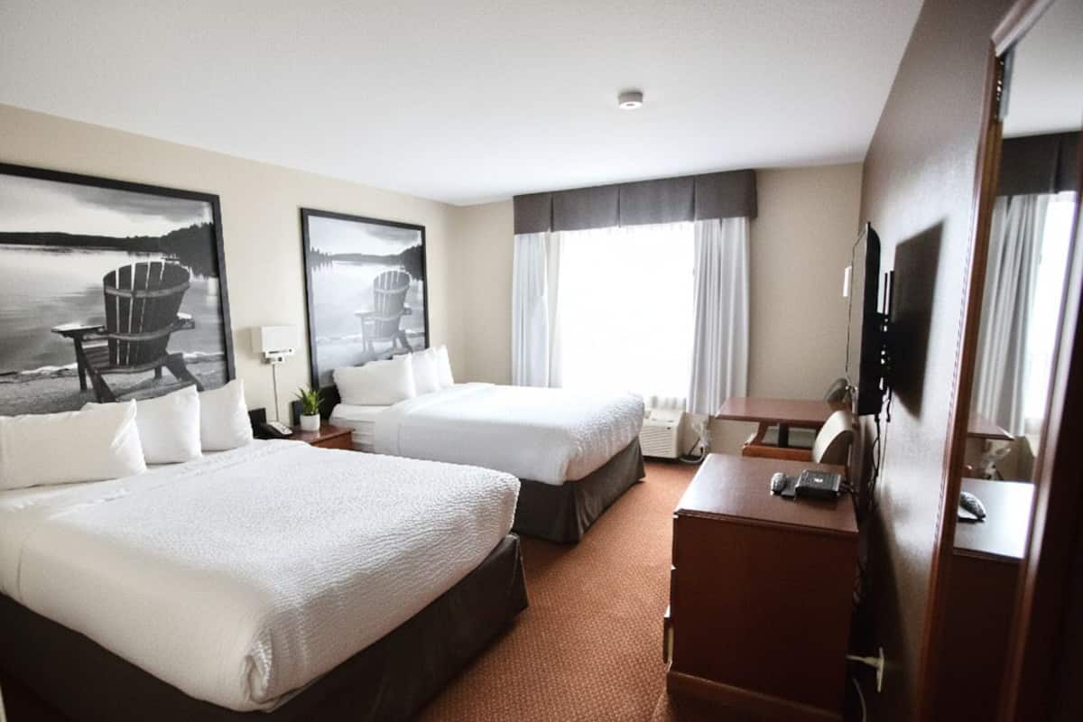 Premium bedding, down comforters, laptop workspace, blackout drapes