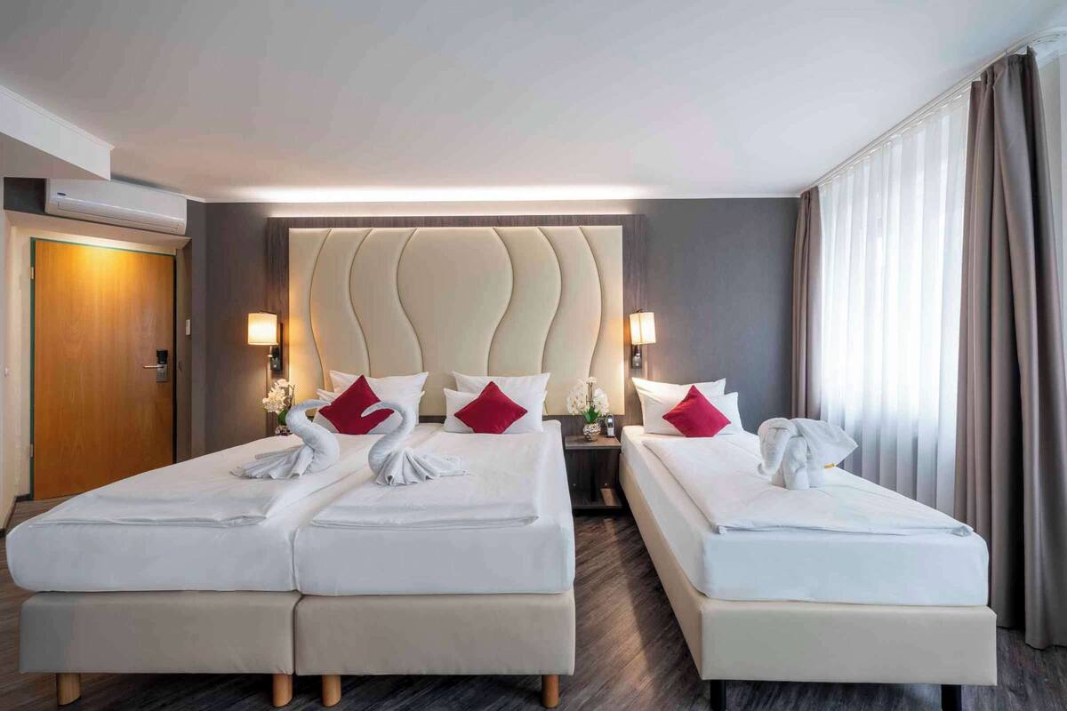 premium room, 3 single beds (cozy sitting corner) | minibar, in-room safe, desk, blackout curtains