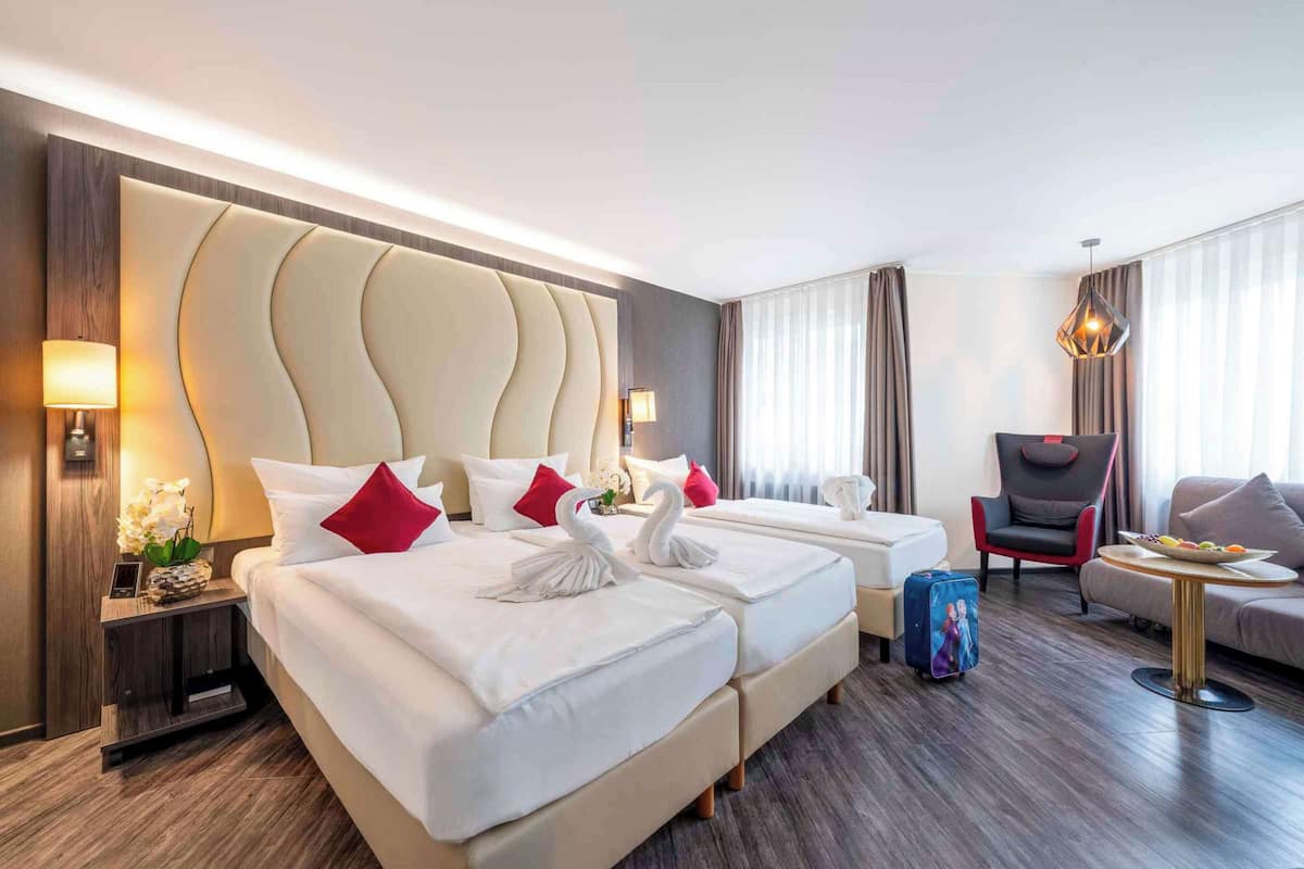 premium room, 3 single beds (cozy sitting corner) | minibar, in-room safe, desk, blackout curtains