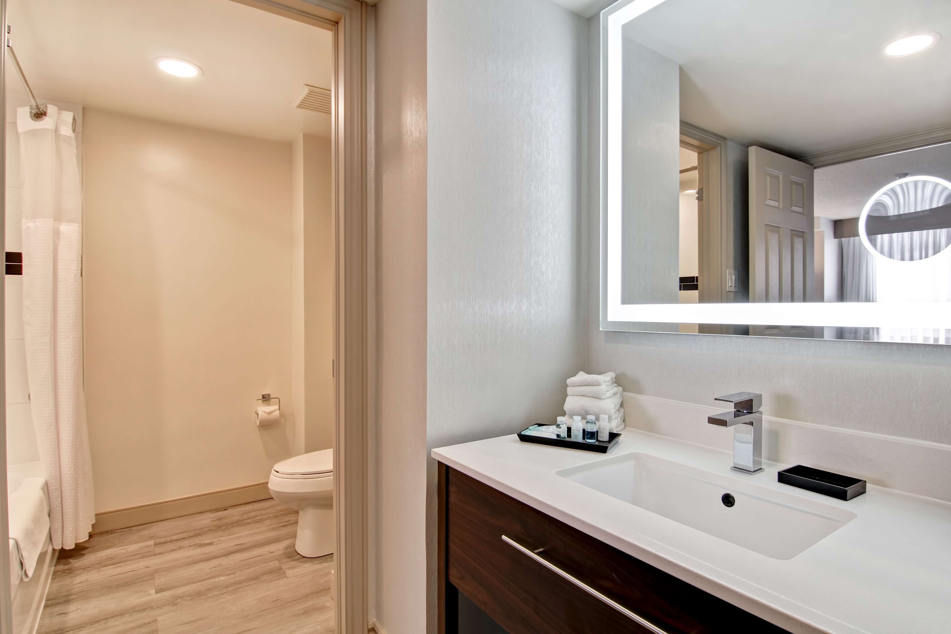 Combined shower/tub, designer toiletries, hair dryer, towels