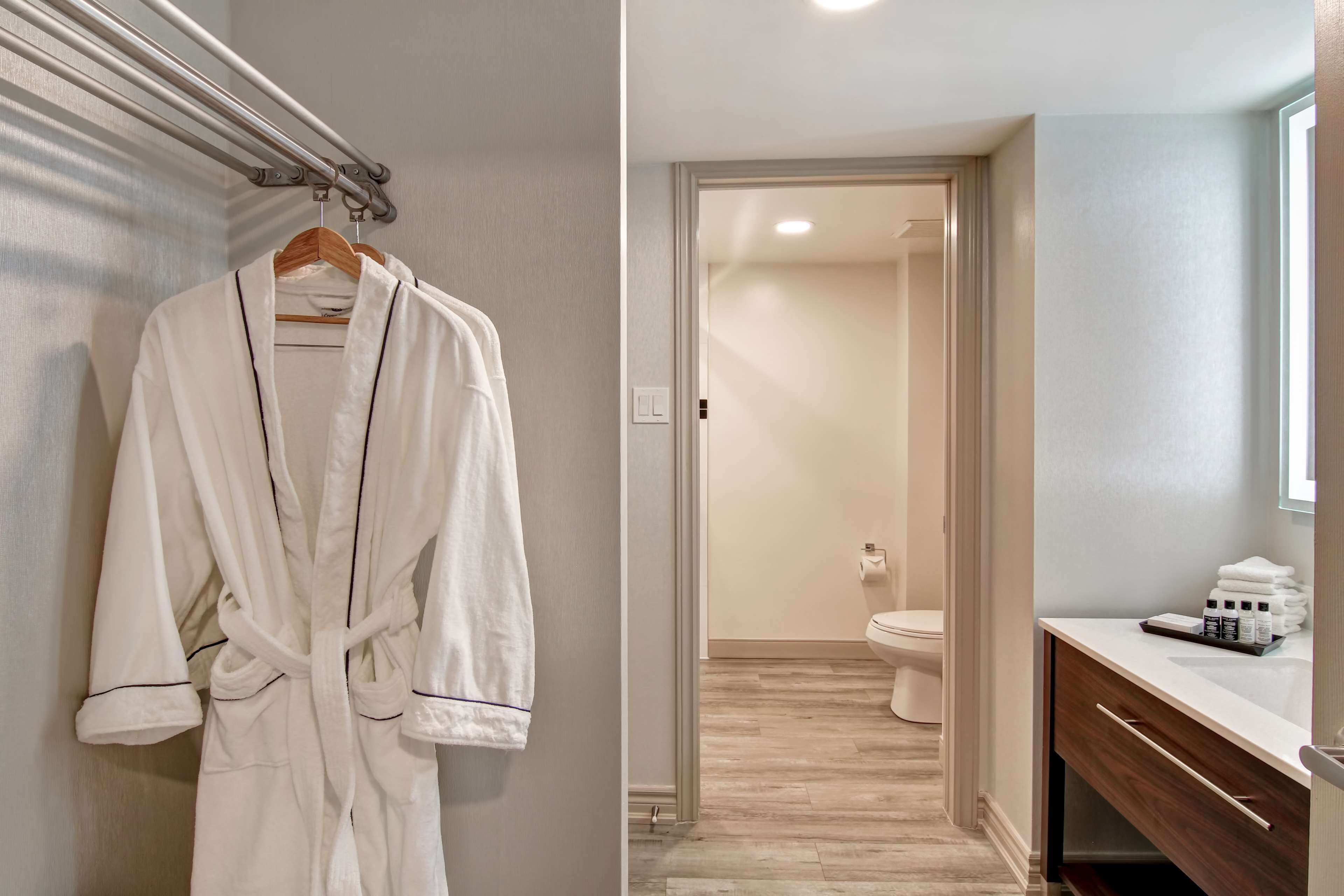 combined shower/bathtub, designer toiletries, hair dryer, towels