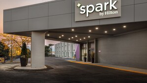 A hotel entrance with a sign reading "spark by Hilton" and a covered walkway. - Spark by Hilton Toronto Airport (Toronto)