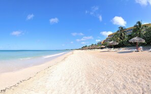 On the beach, sun loungers, beach towels, scuba diving