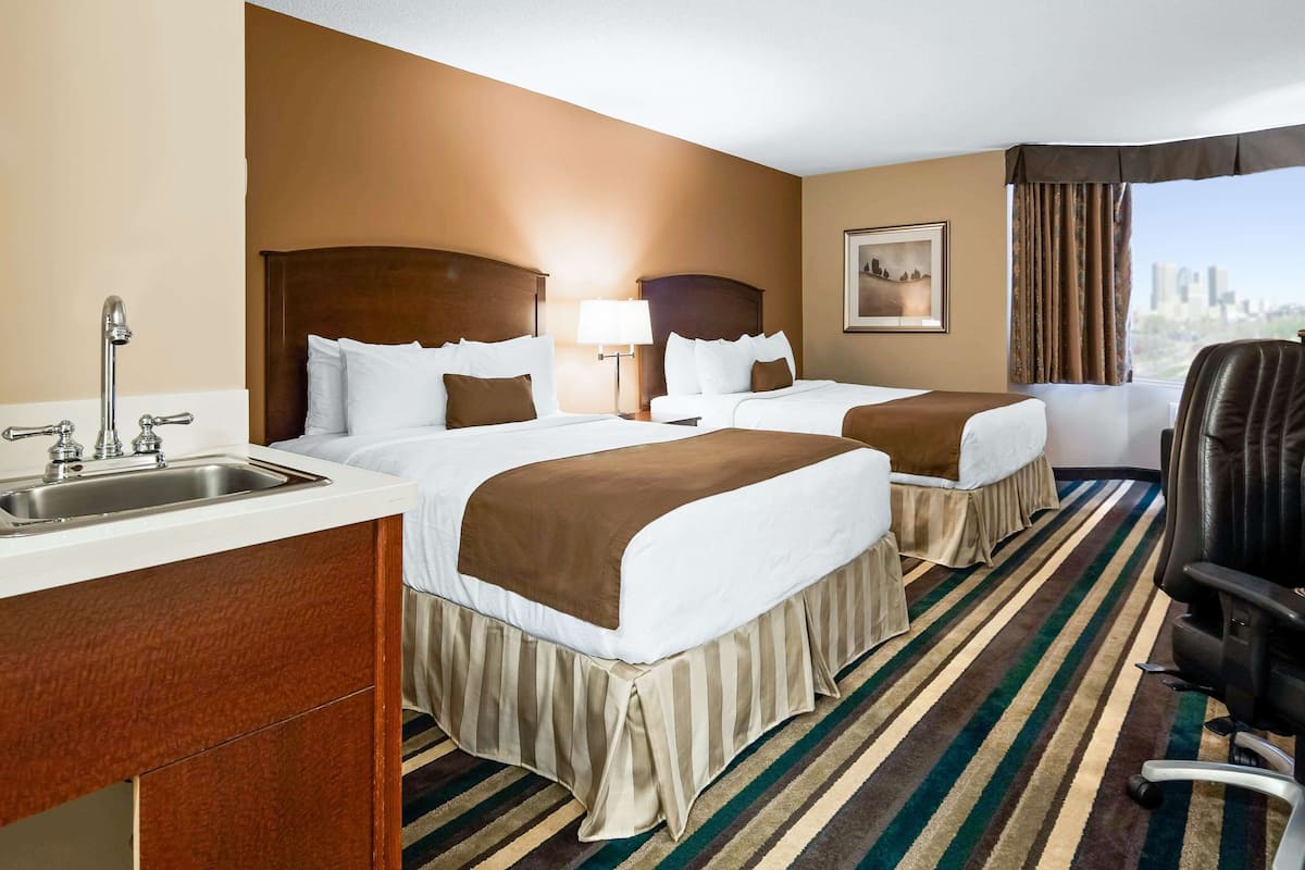 standard room, 2 queen beds, non smoking, refrigerator | 1 bedroom, premium bedding, pillow-top beds, desk