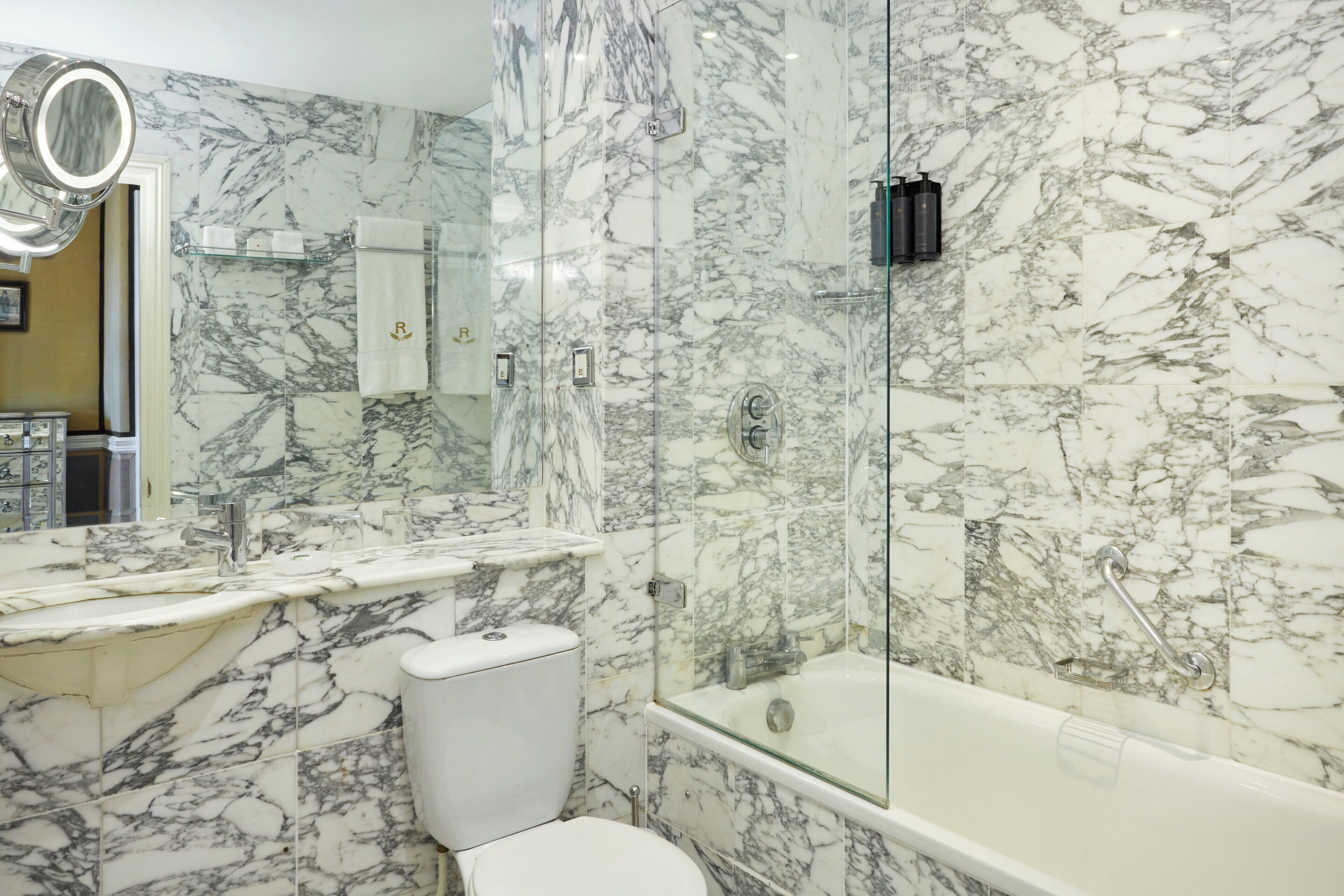 combined shower/bathtub, designer toiletries, hair dryer, bathrobes