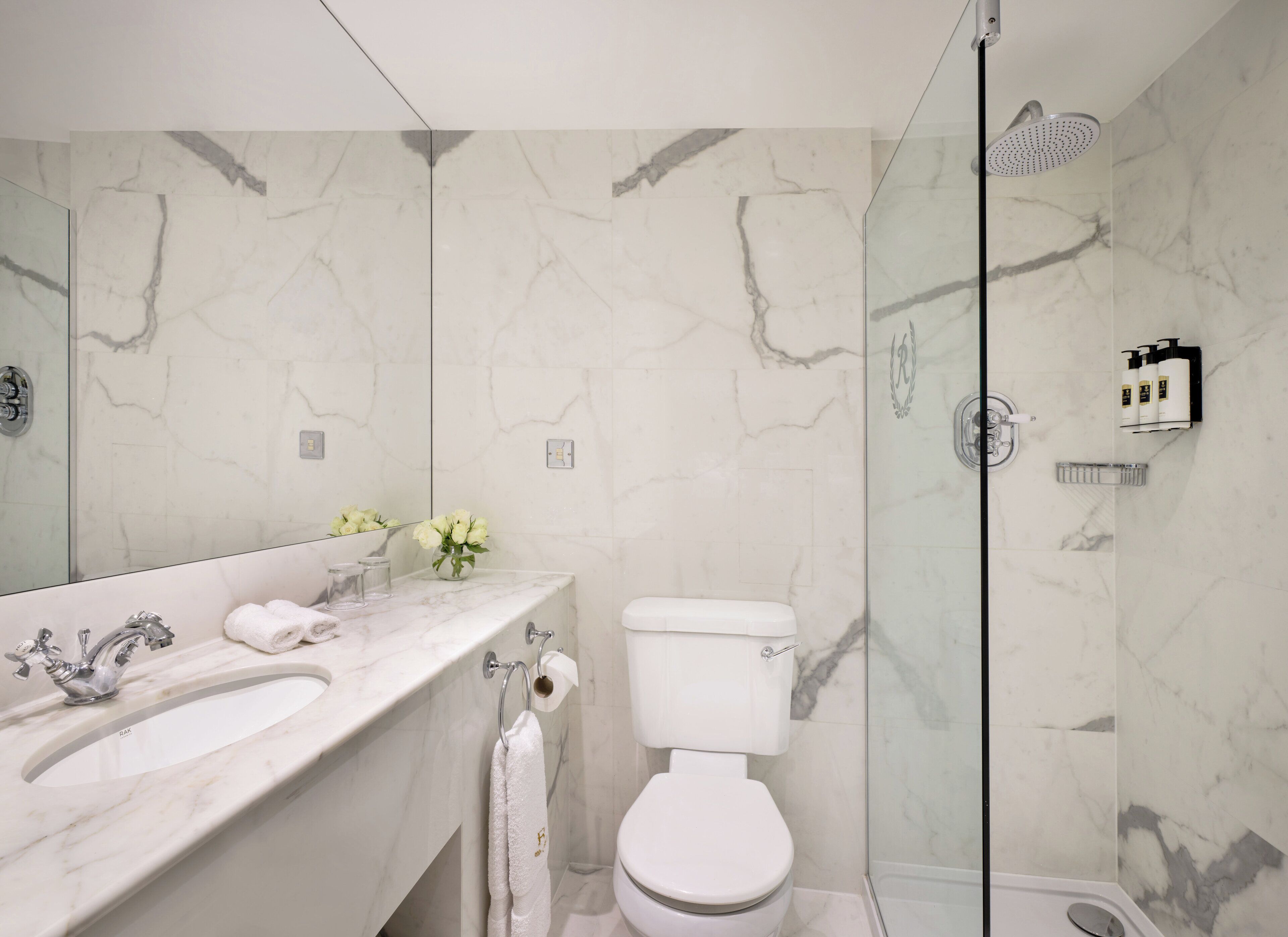 Combined shower/tub, designer toiletries, hair dryer, bathrobes