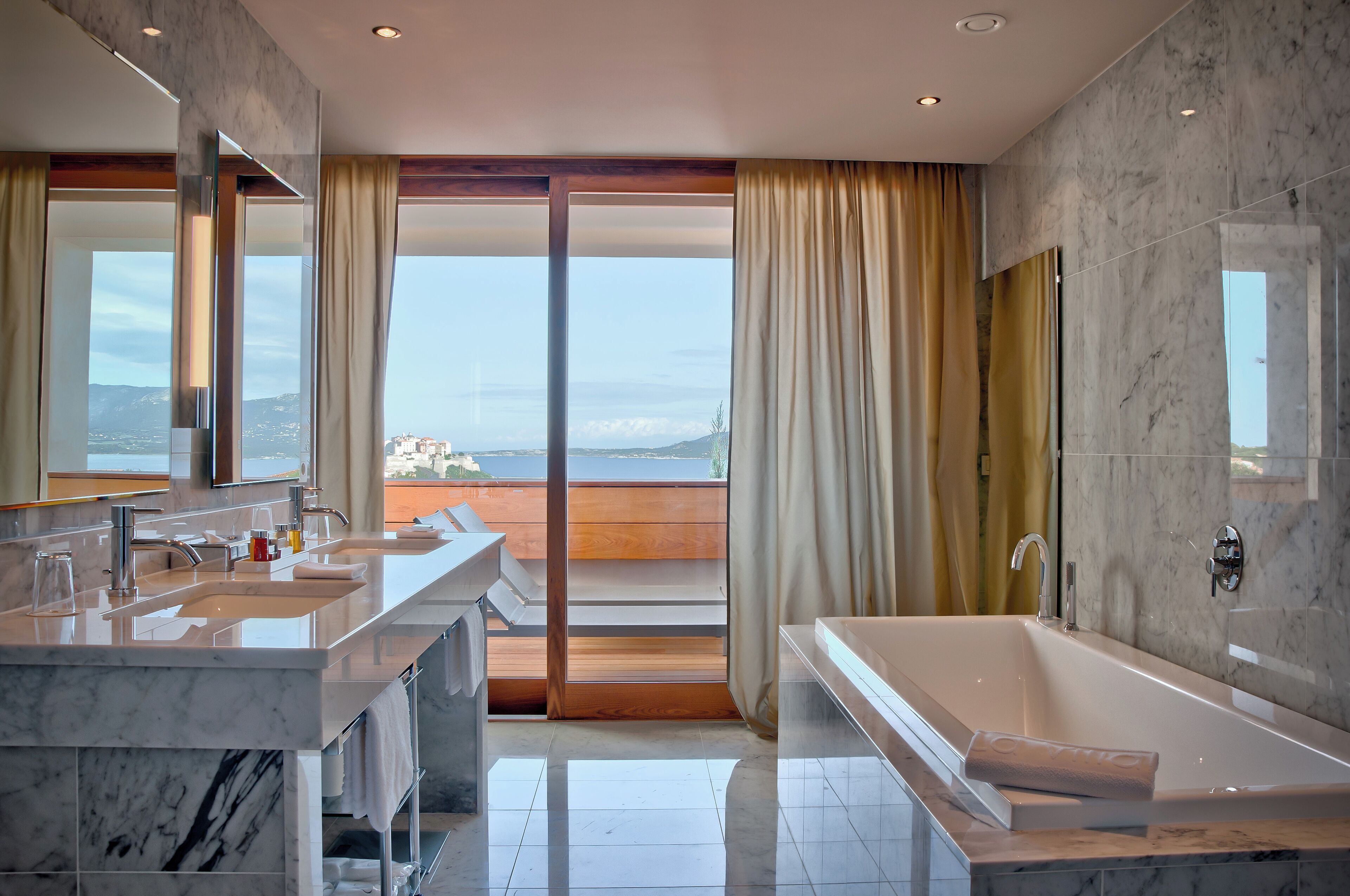 designer toiletries, hair dryer, bathrobes, slippers