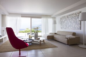 100-cm flat-screen TV with satellite channels, iPod dock, books