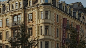 A historic building with ornate architectural details, including multiple balconies and large windows. - Hotel Alden Splügenschloss Zürich - Leonardo Limited Edition (Zürich)