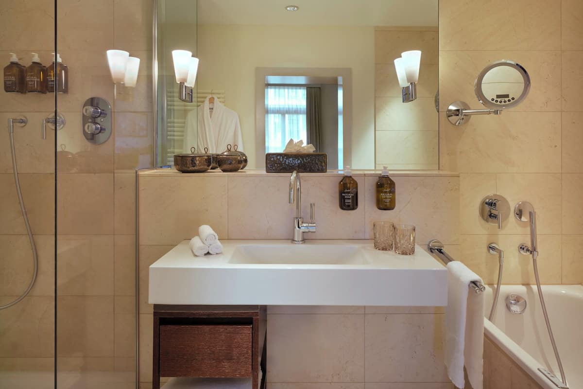 deluxe suite | bathroom | separate bathtub and shower, jetted bath, designer toiletries