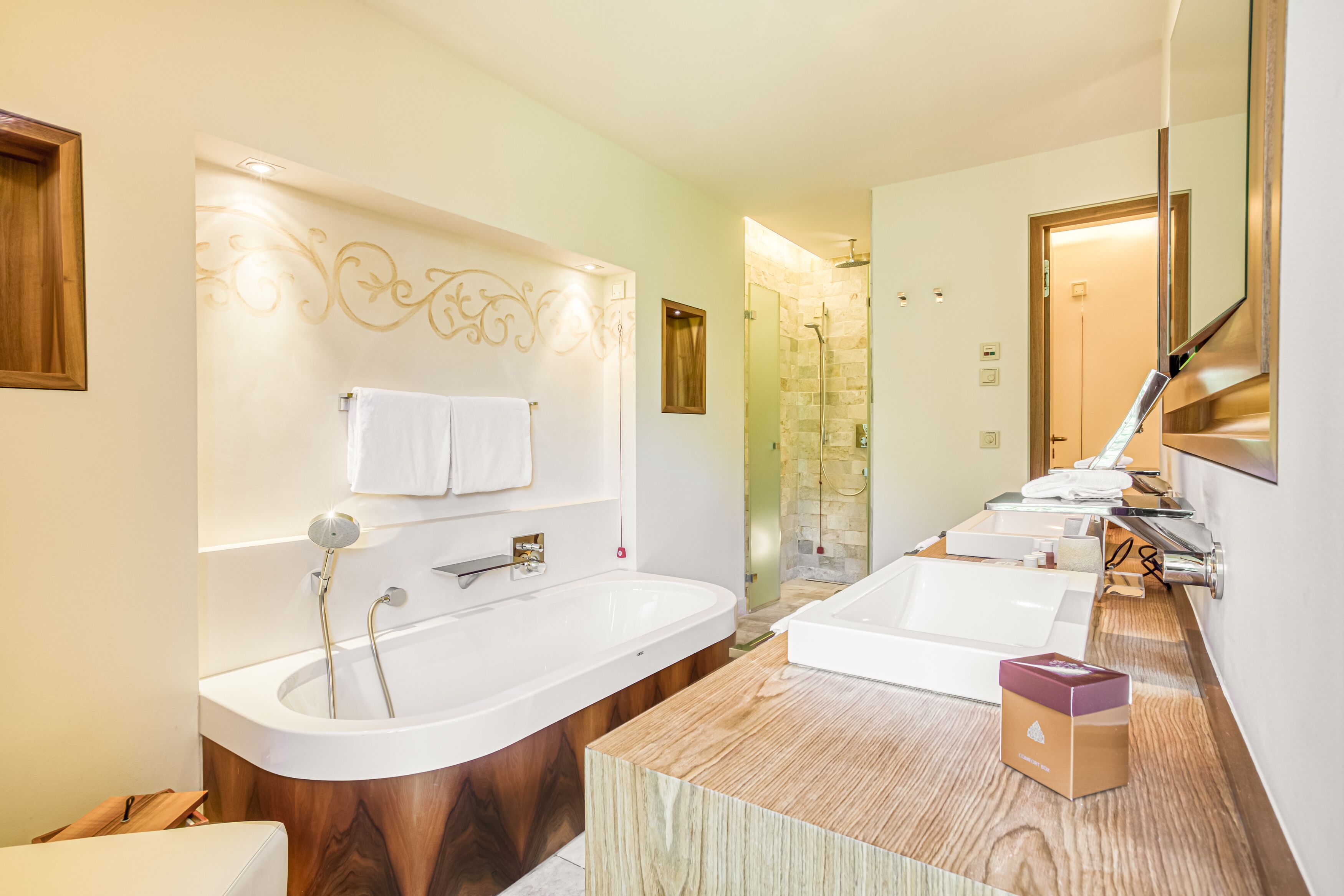superior junior suite spa-haus | bathroom | separate bathtub and shower, designer toiletries, hair dryer, bathrobes