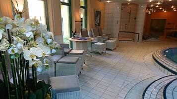 Relax in style with plush wicker chairs and a warm, inviting atmosphere.