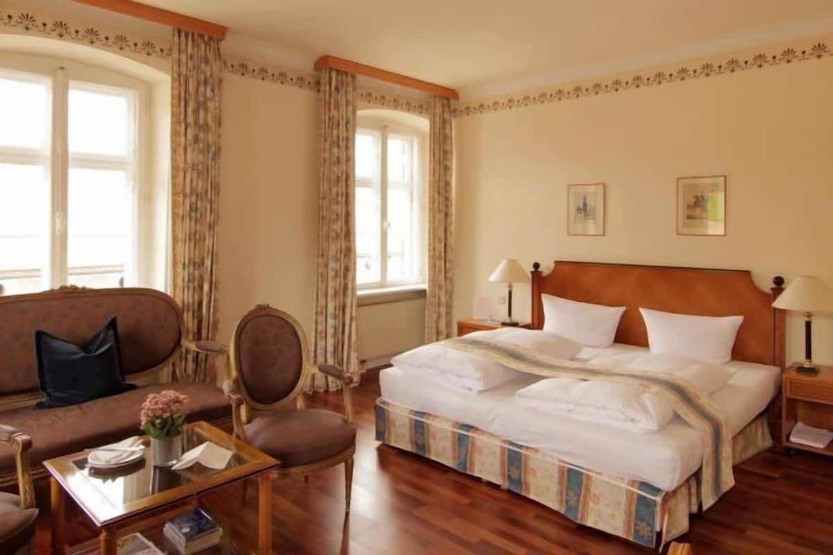 Hypo-allergenic bedding, down duvets, pillow-top beds, minibar
