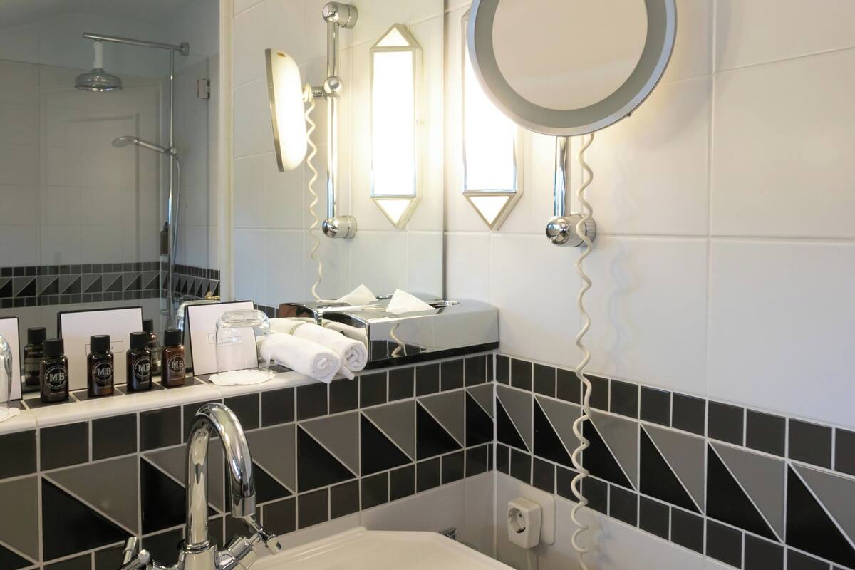 suite, patio, courtyard view | bathroom | free toiletries, hair dryer, bathrobes, slippers