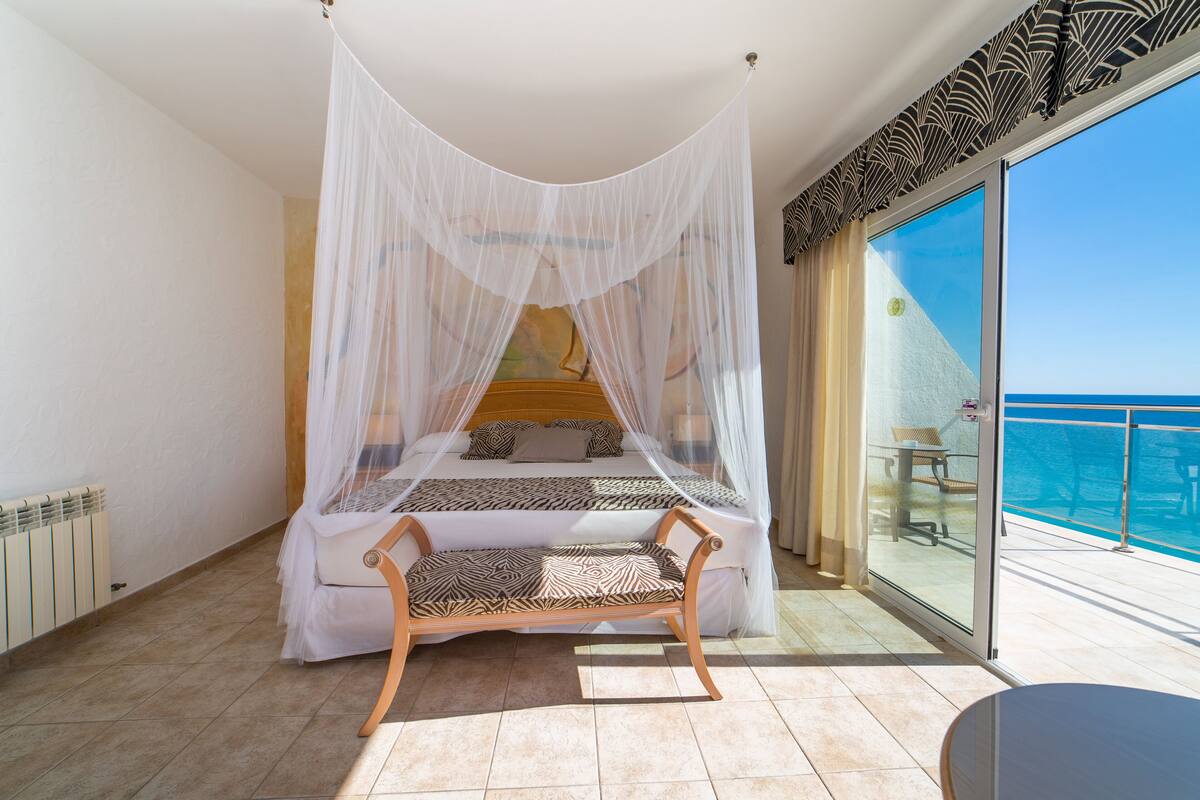 romantic double room, terrace, sea view | 1 bedroom, minibar, in-room safe, desk