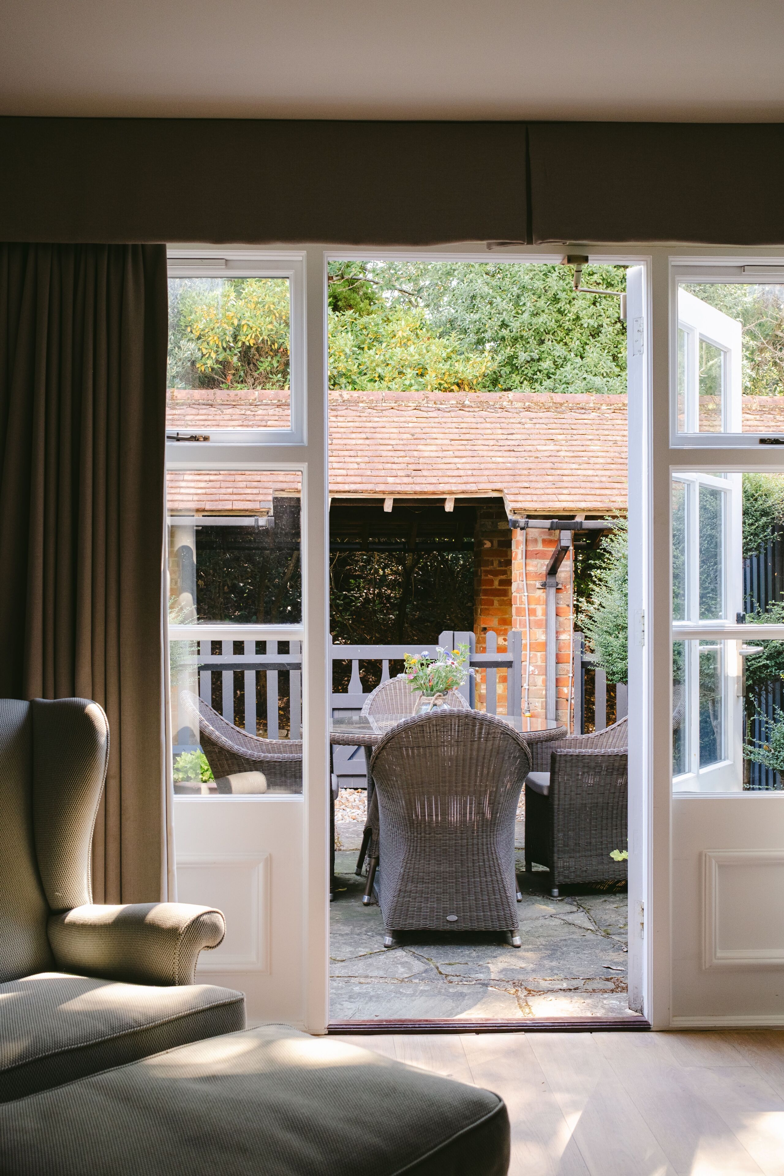 A room with a view of an outdoor patio area.