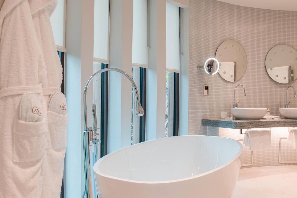 combined shower/bathtub, deep-soaking bathtub, designer toiletries