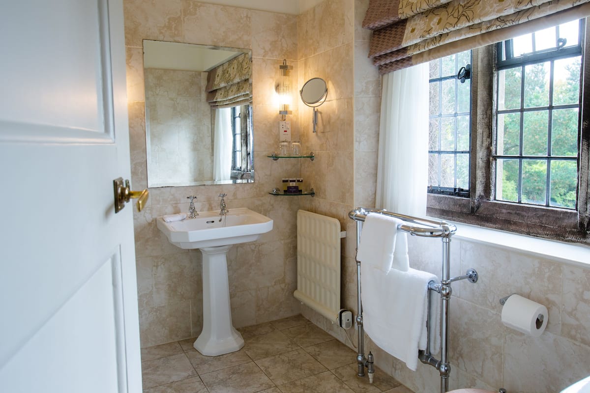 deluxe room | bathroom | shower, free toiletries, hair dryer, bathrobes