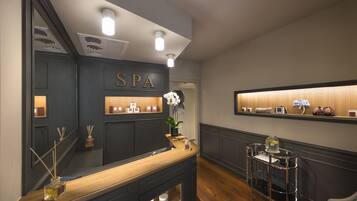 Relax in style at our spa, featuring a minimalist reception area with a reception desk and a convenient cart for your needs.