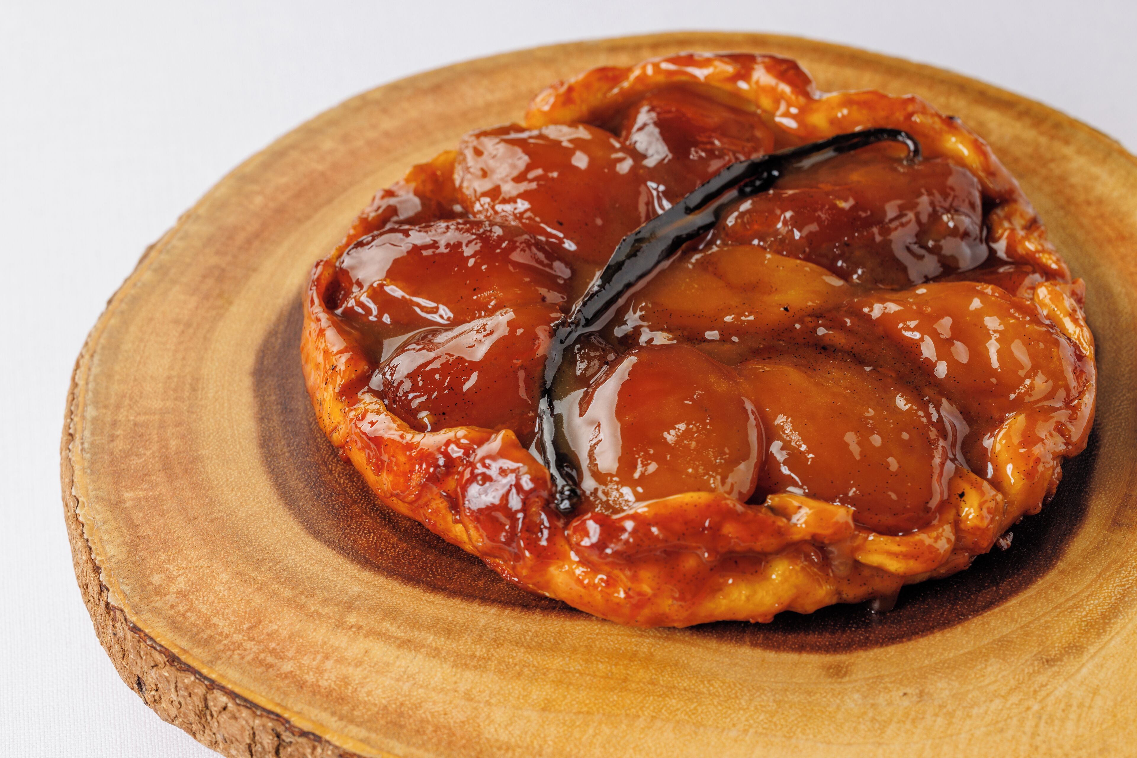 A dessert on a wooden plate.