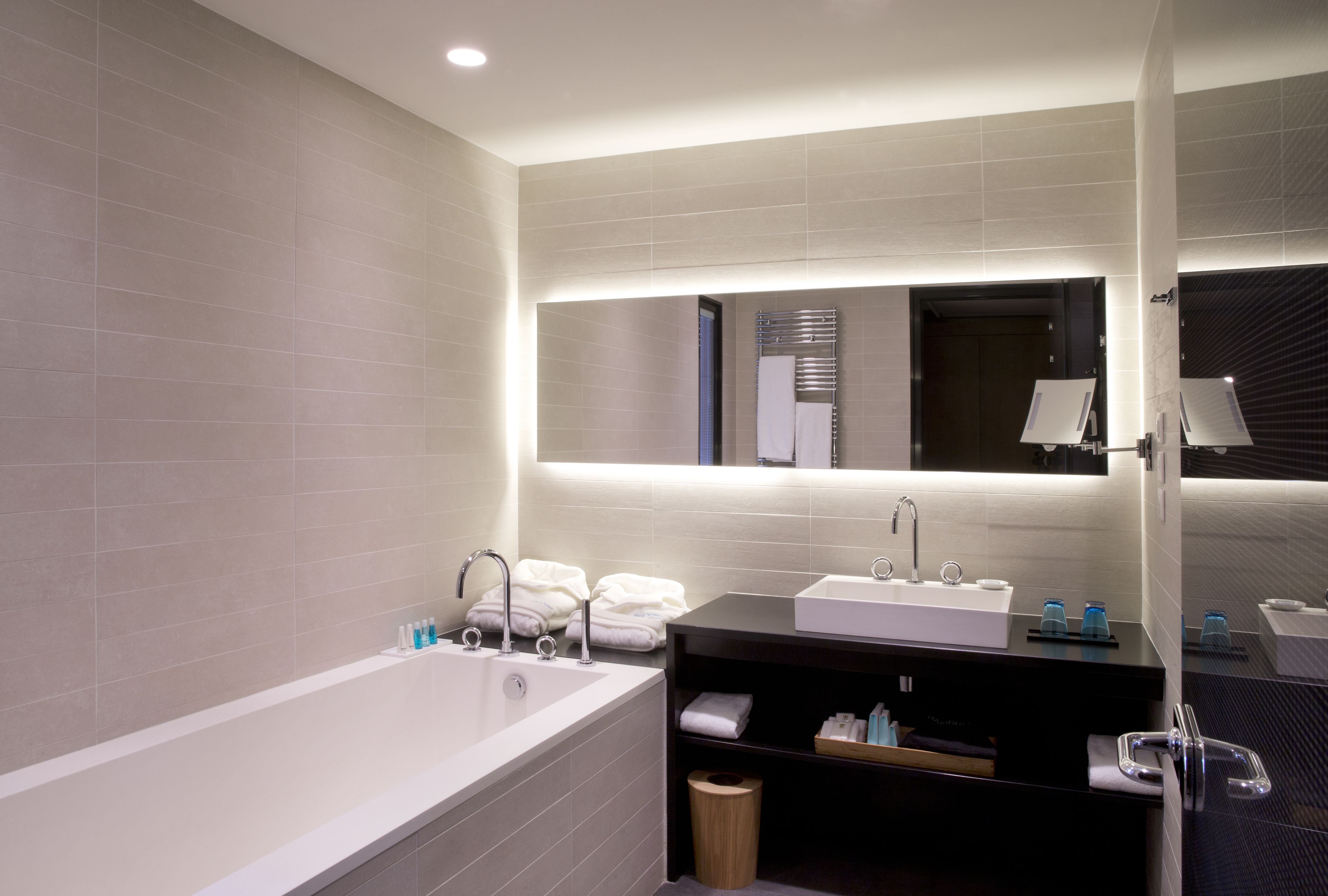 deluxe room | bathroom | rainfall showerhead, free toiletries, hair dryer, towels