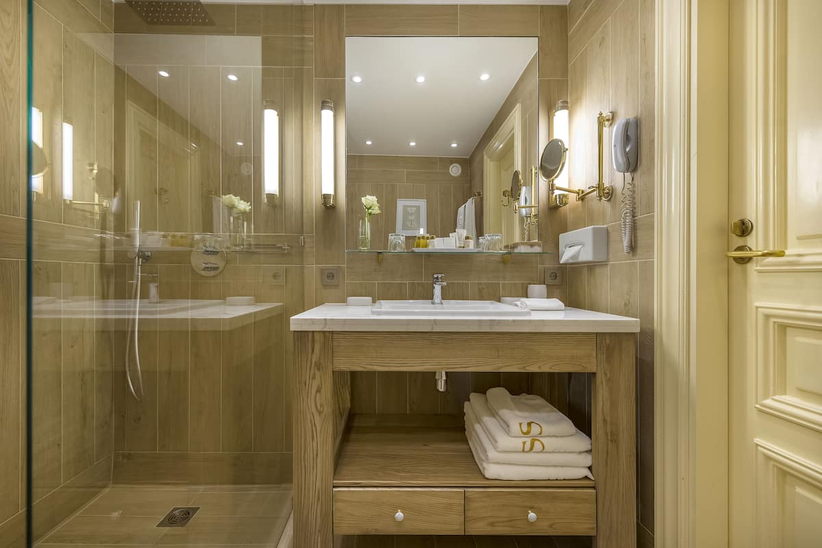 classic double room | bathroom | separate bathtub and shower, rainfall showerhead, designer toiletries