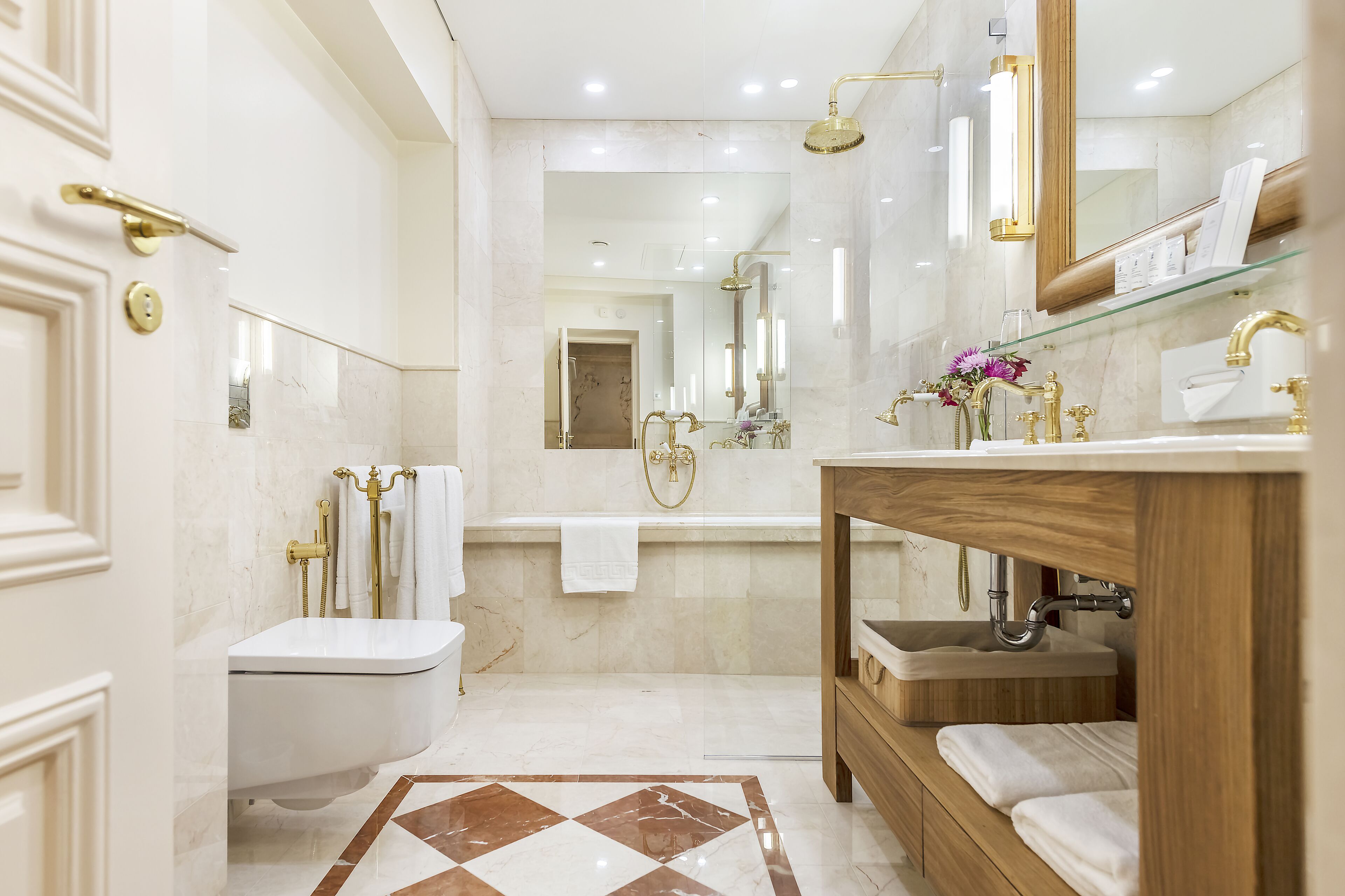 grand suite | bathroom | separate bathtub and shower, rainfall showerhead, designer toiletries