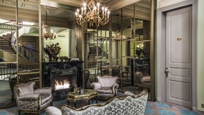 A grand lobby with a chandelier, ornate sofas, a fireplace, and a staircase. - Bosphorus Palace Hotel - Special Class (Istanbul)