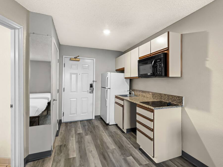 Fridge, microwave, stovetop, coffee/tea maker