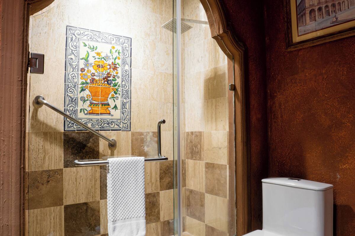 designer toiletries, hair dryer, towels, soap