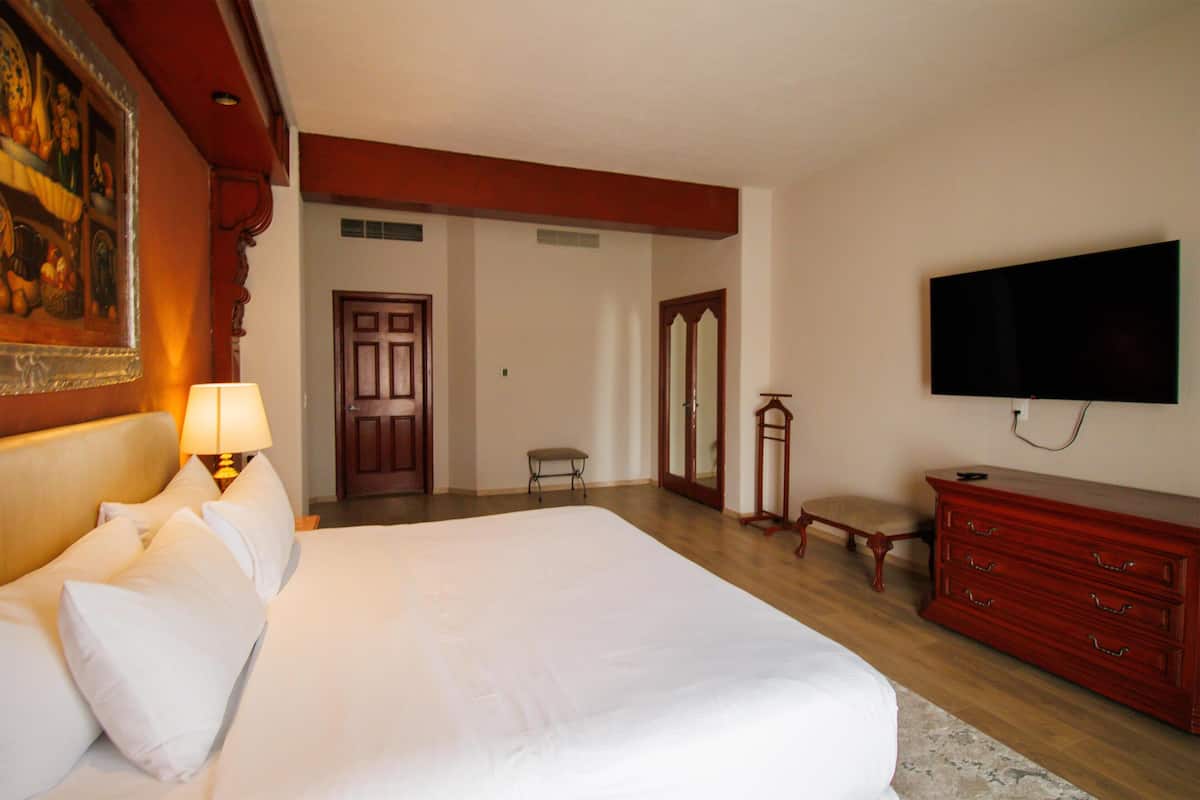 Suite, 1 Bedroom, 1 King Bed | Premium bedding, in-room safe, individually decorated, blackout drapes