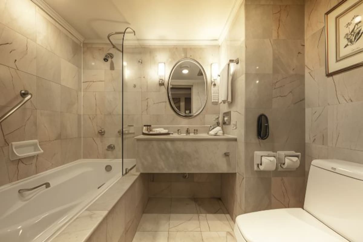 A bathroom with a bathtub, a sink, a toilet, and a shower.