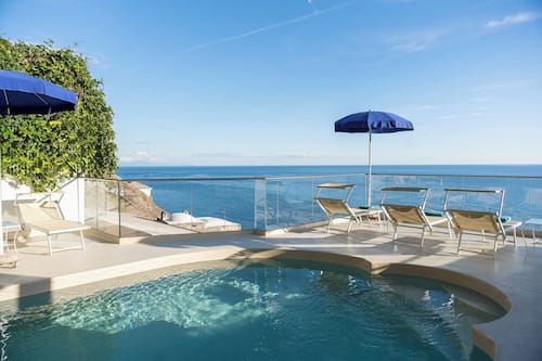 Seasonal outdoor pool, open 9:00 AM to 6:30 PM, pool umbrellas