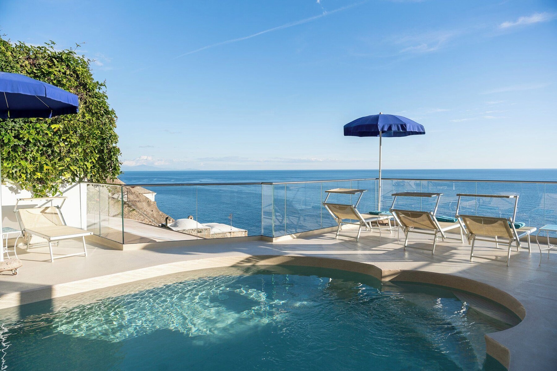 Seasonal outdoor pool, open 9:00 AM to 6:30 PM, pool umbrellas