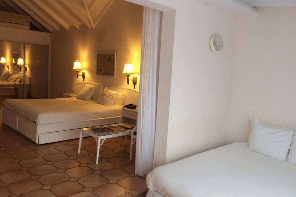 Standard Quadruple Room, 2 Bedrooms, Garden View | Minibar, in-room safe, desk, blackout drapes