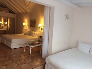 Standard Quadruple Room, 2 Bedrooms, Garden View | Minibar, in-room safe, desk, blackout curtains