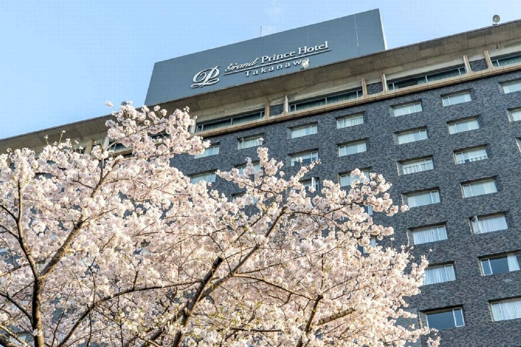 A hotel building with a sign reading "Grand Prince Hotel Takawawa."