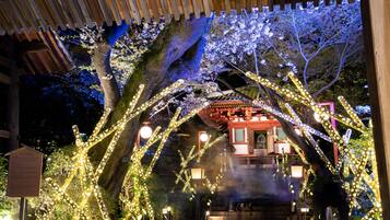 A traditional Japanese building with a wooden structure and a covered entrance.