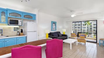 A compact living space with a kitchen, dining area, and seating area.