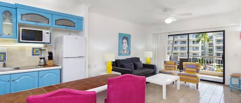 A compact living space with a kitchen, dining area, and seating area.