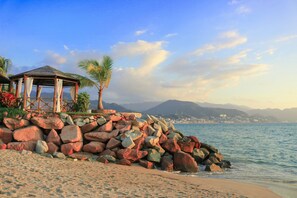 On the beach, sun loungers, beach umbrellas, beach towels