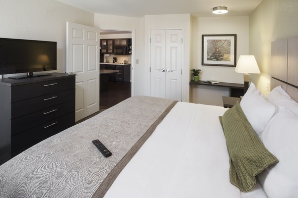 Desk, laptop workspace, blackout drapes, iron/ironing board