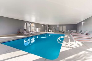 Indoor pool, open 9:00 AM to 9:00 PM, pool loungers