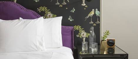 Premium bedding, desk, laptop workspace, soundproofing