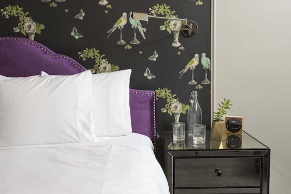 Premium bedding, desk, laptop workspace, soundproofing