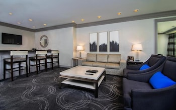 Suite, 2 Bedrooms | Living area | 42-inch flat-screen TV with cable channels, TV, pay movies at Suncoast Hotel and Casino