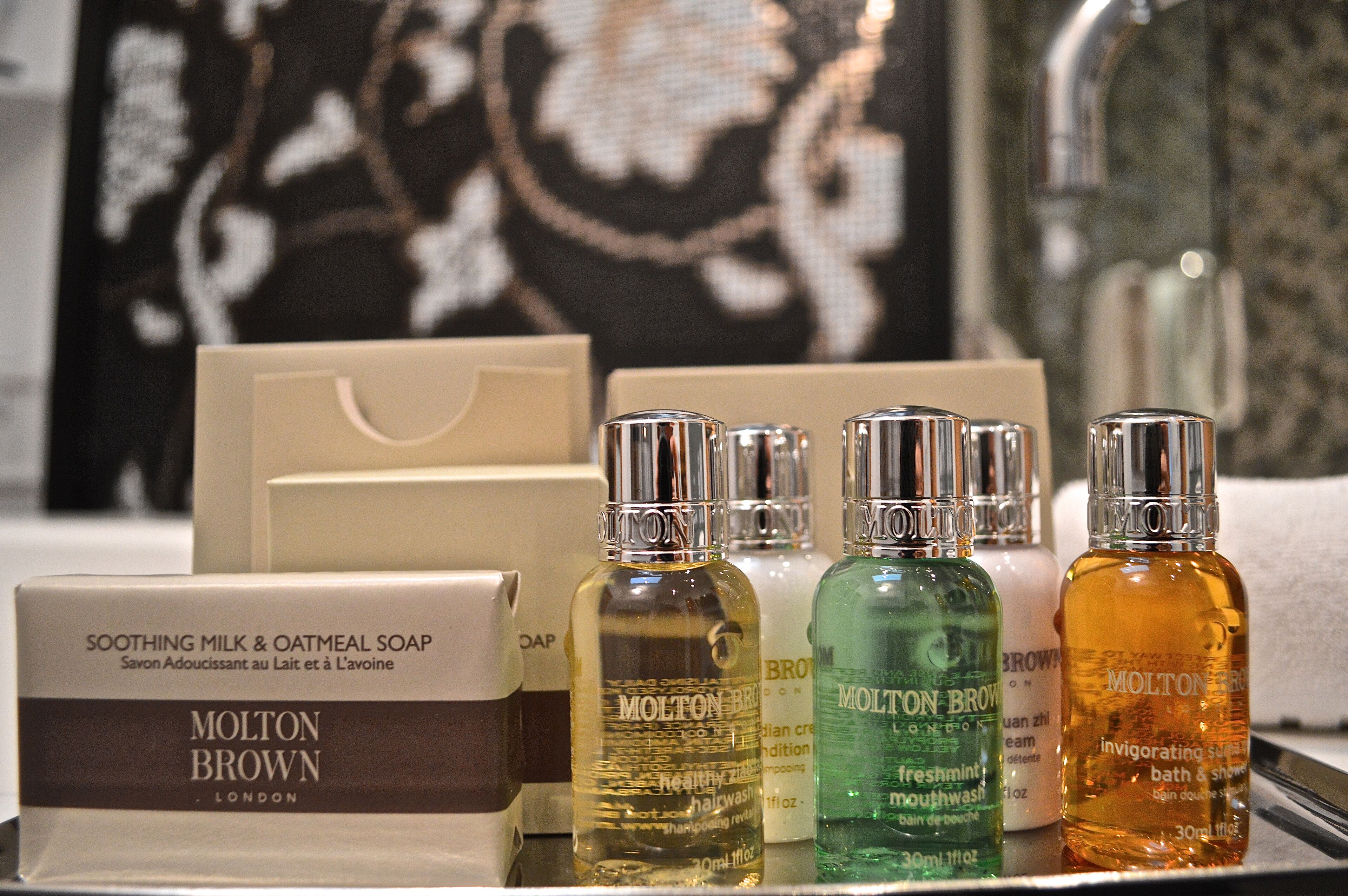 designer toiletries, hair dryer, bathrobes, slippers