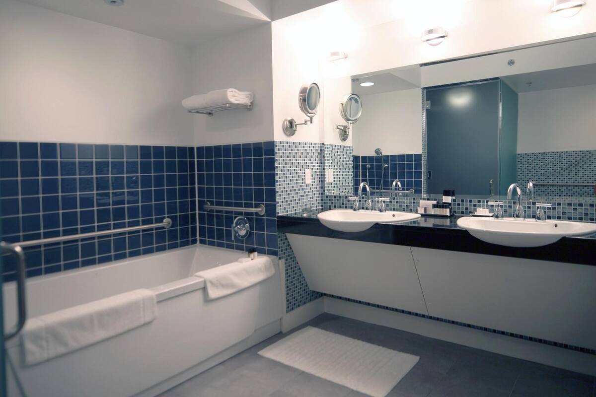 the new amsterdam suite  | bathroom | designer toiletries, hair dryer, bathrobes, slippers