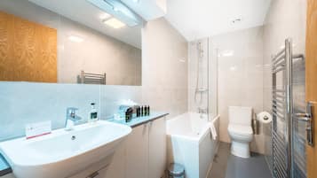 Combined shower/tub, designer toiletries, hair dryer, towels